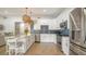 Well-equipped kitchen with stainless steel appliances and modern white cabinetry at 1633 Ridgewood Ln, Sarasota, FL 34231