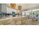 Modern kitchen with white countertops, subway tile backsplash, and a breakfast bar at 1633 Ridgewood Ln, Sarasota, FL 34231