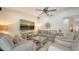 Comfortable living room featuring neutral tones, stylish decor, and a large flat-screen TV at 1633 Ridgewood Ln, Sarasota, FL 34231