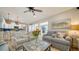 Open-concept living space with hardwood floors, stylish furnishings, and seamless transition to the kitchen at 1633 Ridgewood Ln, Sarasota, FL 34231