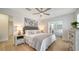 Bedroom featuring a ceiling fan, nightstands, and view to the office space at 1633 Ridgewood Ln, Sarasota, FL 34231