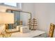 A stylish vanity area features a modern mirror, ample lighting, and chic decor enhancing the room's ambiance at 1633 Ridgewood Ln, Sarasota, FL 34231
