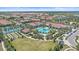 Bird's-eye view captures the community's pool, amenity center, recreation areas, and residential neighborhoods at 16810 Scuba Crest St, Wimauma, FL 33598