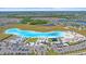 Experience resort-style living with white sand beaches, splash park, swim up bar, and luxurious amenities at 16810 Scuba Crest St, Wimauma, FL 33598