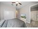Bedroom with wood flooring, closet, and en suite bathroom with a shower and tub at 16810 Scuba Crest St, Wimauma, FL 33598