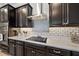 Modern kitchen featuring stainless steel appliances and elegant backsplash at 16810 Scuba Crest St, Wimauma, FL 33598