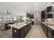 Open-concept kitchen with an island, stainless steel appliances, open to living space at 16810 Scuba Crest St, Wimauma, FL 33598