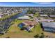 An aerial shot highlights this home's screened pool and lush landscaping at 1714 Coral Sands Ct, Venice, FL 34293