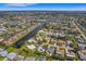 An aerial view shows this waterfront house situated in a beautiful residential neighborhood at 1714 Coral Sands Ct, Venice, FL 34293