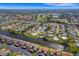 A high angle shows a waterfront home, enhanced by serene surroundings and golf course views at 1714 Coral Sands Ct, Venice, FL 34293
