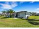 Spacious backyard featuring a screened pool area with easy access to the home's exterior at 1714 Coral Sands Ct, Venice, FL 34293