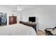 Bedroom featuring a ceiling fan and wooden furniture with ample storage at 1714 Coral Sands Ct, Venice, FL 34293