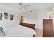 Bedroom featuring a ceiling fan, tile floors and an all-white closet door at 1714 Coral Sands Ct, Venice, FL 34293