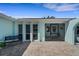 Inviting front entry featuring tiled flooring, bench seating, and a decorative door with a screen at 1714 Coral Sands Ct, Venice, FL 34293
