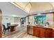 Kitchen with stainless steel appliances, wooden cabinets, and a view of the screened-in lanai at 1714 Coral Sands Ct, Venice, FL 34293