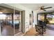 Covered lanai with ceiling fan and open view of the screened-in pool and backyard at 1714 Coral Sands Ct, Venice, FL 34293