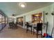 Covered lanai with ceiling fan and an open view of the backyard at 1714 Coral Sands Ct, Venice, FL 34293