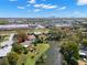 Magnificent aerial view of houses near a lake, and a red arrow pointing to a home at 1940 35Th N St, St Petersburg, FL 33713