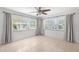 Bright bedroom features tiled floors, neutral paint, and large windows with natural light at 1940 35Th N St, St Petersburg, FL 33713