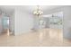 Open dining room featuring tile flooring, decorative chandelier and a beautiful view of the exterior at 1940 35Th N St, St Petersburg, FL 33713