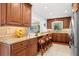 Beautiful kitchen with custom wood cabinets, granite countertops, and stainless-steel appliances at 1940 35Th N St, St Petersburg, FL 33713
