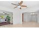 Open living space featuring tile flooring connecting sunroom, kitchen and front entry at 1940 35Th N St, St Petersburg, FL 33713