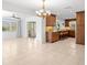Bright, open-concept living room flows into the kitchen, featuring tile floors and natural light at 1940 35Th N St, St Petersburg, FL 33713