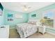 Bedroom with beachy decor, a ceiling fan, and a closet at 202 75Th St # A, Holmes Beach, FL 34217