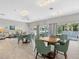 Inviting clubhouse space with cozy seating arrangements, tables, and natural light at 2526 Clubhouse Dr # 203, Sarasota, FL 34232