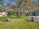 Community picnic area with grill and mature landscaping at 2526 Clubhouse Dr # 203, Sarasota, FL 34232