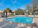 Refreshing community pool with clear blue water and comfortable lounge area at 2526 Clubhouse Dr # 203, Sarasota, FL 34232