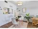 Charming dining area with modern table and decor next to kitchen opening at 2526 Clubhouse Dr # 203, Sarasota, FL 34232