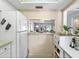 Open kitchen with bright view to the living and dining room at 2526 Clubhouse Dr # 203, Sarasota, FL 34232