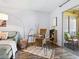 Cozy living room with sliding doors to an outdoor patio, complete with a desk and comfortable seating at 2526 Clubhouse Dr # 203, Sarasota, FL 34232