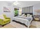 Comfortable bedroom with sliding doors leading to screened in patio with nice decor at 2526 Clubhouse Dr # 203, Sarasota, FL 34232