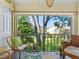 Screened-in patio featuring ceiling fan, tile floor, comfortable seating and exterior views at 2526 Clubhouse Dr # 203, Sarasota, FL 34232