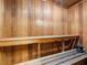 Relaxing sauna room featuring wood-paneled walls and comfortable benches at 2526 Clubhouse Dr # 203, Sarasota, FL 34232