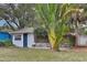 Charming single-story home with a blue front door and tropical landscaping at 2653 44Th S St, Gulfport, FL 33711