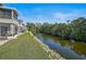 Picturesque backyard view of the waterway and well-maintained landscaping at 2851 Swifton Dr # 39, Sarasota, FL 34231