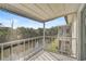 Relaxing screened balcony overlooks tranquil water views and lush tropical landscaping at 2851 Swifton Dr # 39, Sarasota, FL 34231