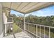 Relaxing screened balcony overlooking a serene waterway and lush greenery at 2851 Swifton Dr # 39, Sarasota, FL 34231
