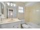 Neat bathroom with tiled shower and single sink vanity at 2851 Swifton Dr # 39, Sarasota, FL 34231