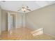 Spacious bedroom with parquet floors leading to bathroom and closet at 2851 Swifton Dr # 39, Sarasota, FL 34231