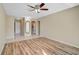Open-concept living space with tile and wood-look flooring and a ceiling fan at 2851 Swifton Dr # 39, Sarasota, FL 34231
