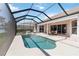 Screened in pool and outdoor dining area at 2879 Grazeland Dr, Sarasota, FL 34240