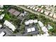 Aerial view of community amenities including tennis courts, a pool, and residential buildings at 348 Springdale Dr # 348, Bradenton, FL 34210