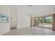 Bedroom showcasing sliding glass doors leading to the screened patio and pool at 402 Pine Ranch East Rd, Osprey, FL 34229