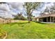 Expansive backyard with mature trees and well-maintained lawn at 4223 Oakhurst E Cir # 3025, Sarasota, FL 34233