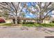 Charming single-story home with well-maintained landscaping and mature trees, offering shade and curb appeal at 4223 Oakhurst E Cir # 3025, Sarasota, FL 34233