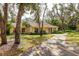 Charming single-story home with manicured landscaping and a paved walkway at 4223 Oakhurst E Cir # 3025, Sarasota, FL 34233